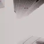 Skyscrapers from below in grayscale – symbolizing market ideology, control, and the illusion of neutrality in Harcourt’s critique