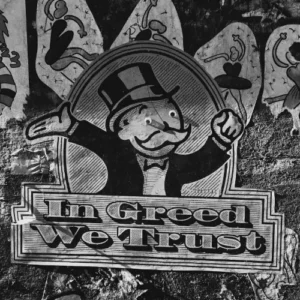 Graffiti mit der Aufschrift „In Greed We Trust“ als Symbol gesellschaftlicher Kapitalismuskritik